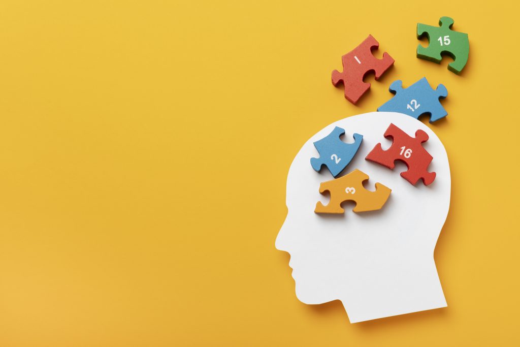 Symbolbild für ADHS: Bunte Puzzleteile im Kopf zeigen die Komplexität neurodivergenter Denkweisen.